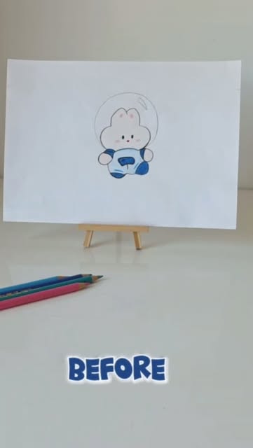 A child's drawing of a blue and white bunny astronaut